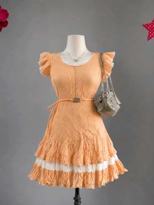 Peachy polka dot dress with belt