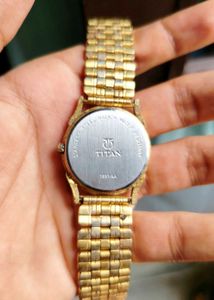 Elegant Gold Titan Watch with Moon Phase