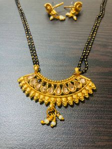 Shining Golden Mangalsutra With Ear Tops Medium Length With Stones/Diamond