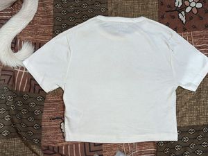 White T-Shirt with Red Bow Detail