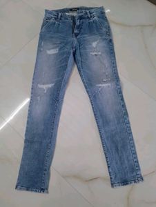 Distressed Light Wash Denim Jeans