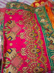 Vibrant Orange Silk Saree with Elephant Motifs