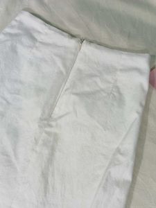 Chic White Mini Skirt with Grommet Detail