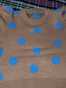 Tan color sweater top with blue dots