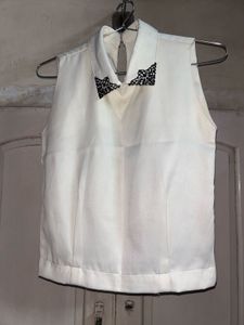 Sleeveless White Top with Black Lace Detail