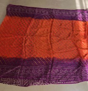 Lovely orange and purple bandhej Saree