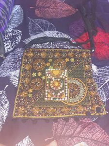 Black color embroided and studded sling bag
