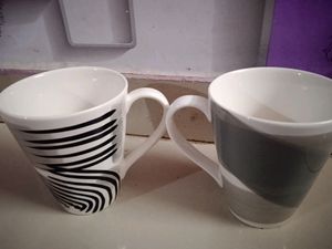 A PAIR OF MUGS WITH MOSAIC COLOUR EFFECT