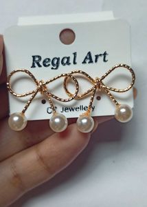 Bow Pearl golden stude Earrings