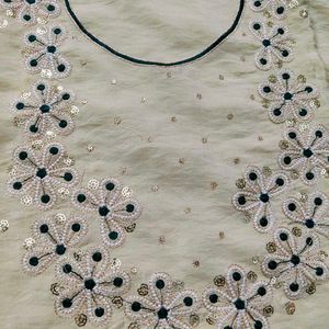 Elegant Cream  dress material with Green Bandhani