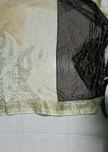 Grand netted tan and coffee brown saree