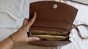 Chic Brown Handbag with Gold Logo