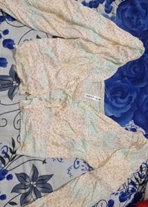 long-sleeve cropped blouse with a tie-front