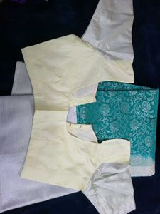 Elegant Teal Saree with Silver Floral Motifs