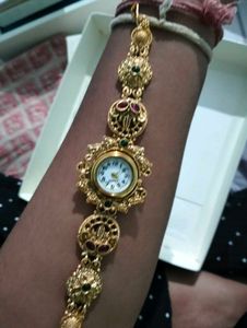 Exquisite Gold Tone Watch with Gemstones
