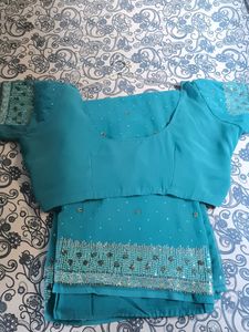 Saree With Stiched Blouse .
