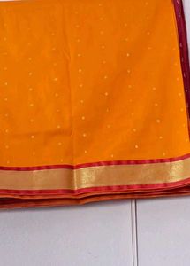 Vibrant Orange Saree with Gold Border