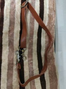 Small adjustible shoulder belt for vanity bags.