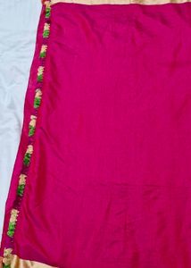 rani pink saree with golden border and tasels