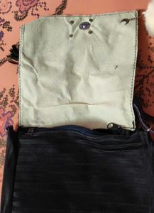 Chic Black Crossbody Bag with Pom Po