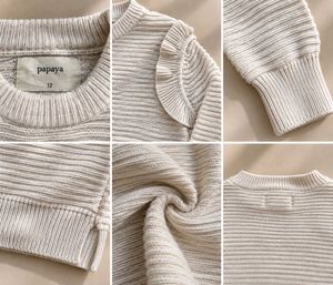 CREAM RIBBED KNIT SWEATER WITH RUFFLE SHOULDER