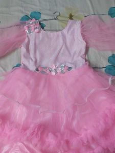 Stylish baby pink colored party wear frock