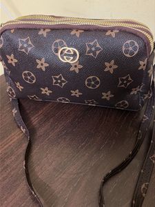 Spacious 3 compartment sling bag