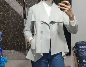 Grey Export branded trenchcoat