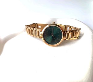 Elegant Gold Watch with Green Dial