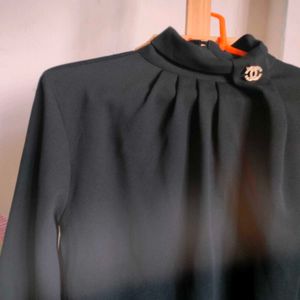 Elegant Black Mock Neck Top with Brooch