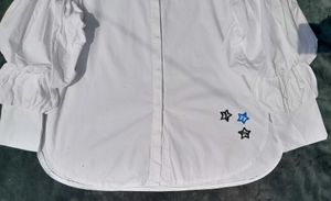 White balloon-sleeve shirt.