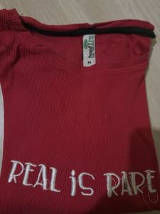 Red T-Shirt with "Real is Rare" slogan