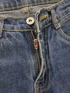 Ripped Knee Blue Jeans