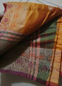Elegant Orange Saree with Intricate Border