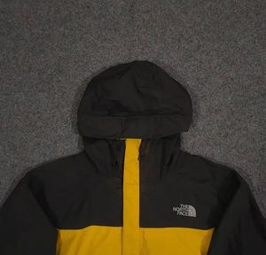 THE NORTH FACE YELLOW AND BLACK JACKET