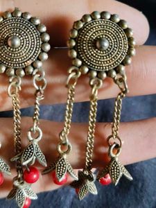 women earrings with red beads hanging