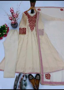 Elegant Cream Kurta Set with Red Embellishments
