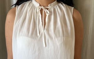 Elegant White Sleeveless Tie-Neck Top