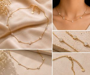 Delicate gold flower and 2 step necklace