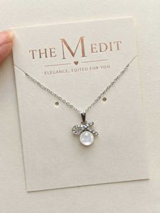 Elegant Bow & Pearl Pendant Necklace