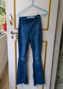 Trendy Flared Jeans with Ripped Knees