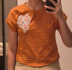 Cute Orange Top with Bow Accent