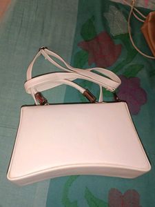 chic white sling and handbag