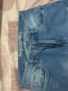 Distressed Blue Denim Jeans