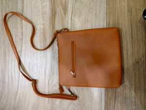 Tan crossbody bag with flower detail