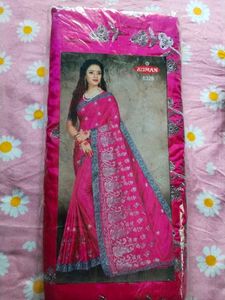 Elegant Pink Saree with Intricate Detailing