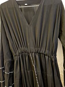 elegant black umbrella abaya with white tiers