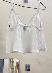 Chic White Cami Top with Black Trim