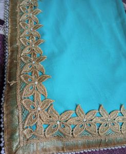 Elegant Turquoise Saree with Golden Embellishments