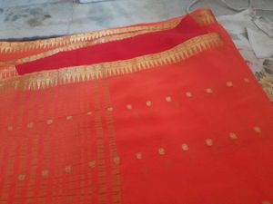 Vibrant Orange Saree with Golden
